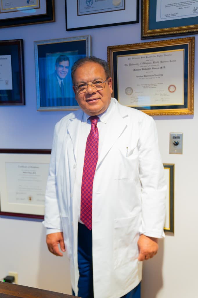 Dr. Mohsen Hamza with diplomas and professional credentials